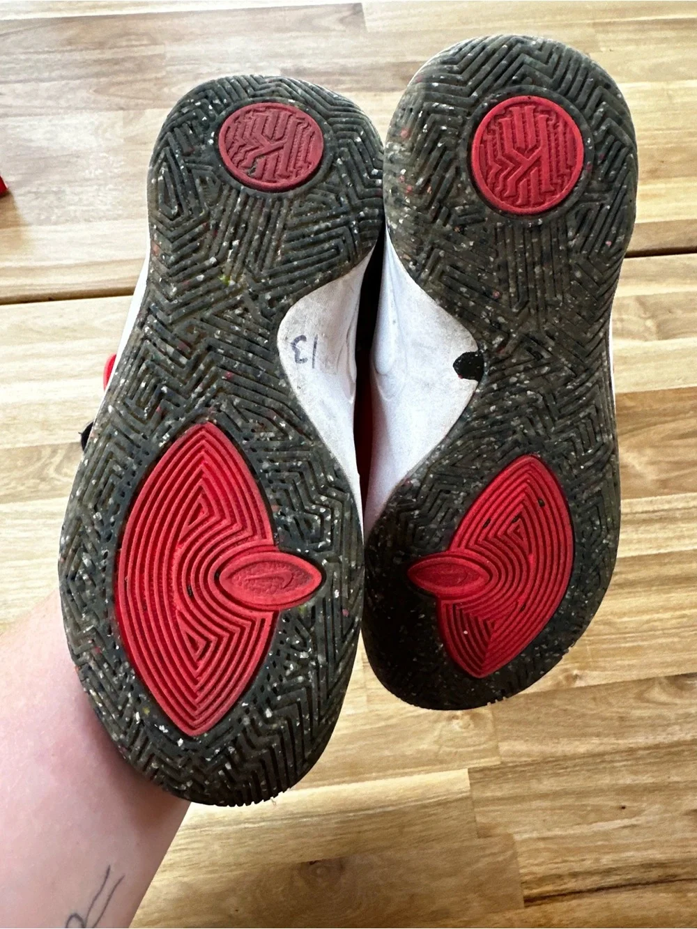 Nike Kyrie 4 sneakers in gray, black, and orange